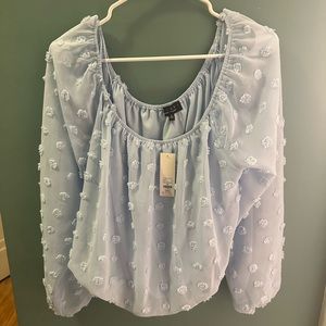 Francesca’s blue blouse